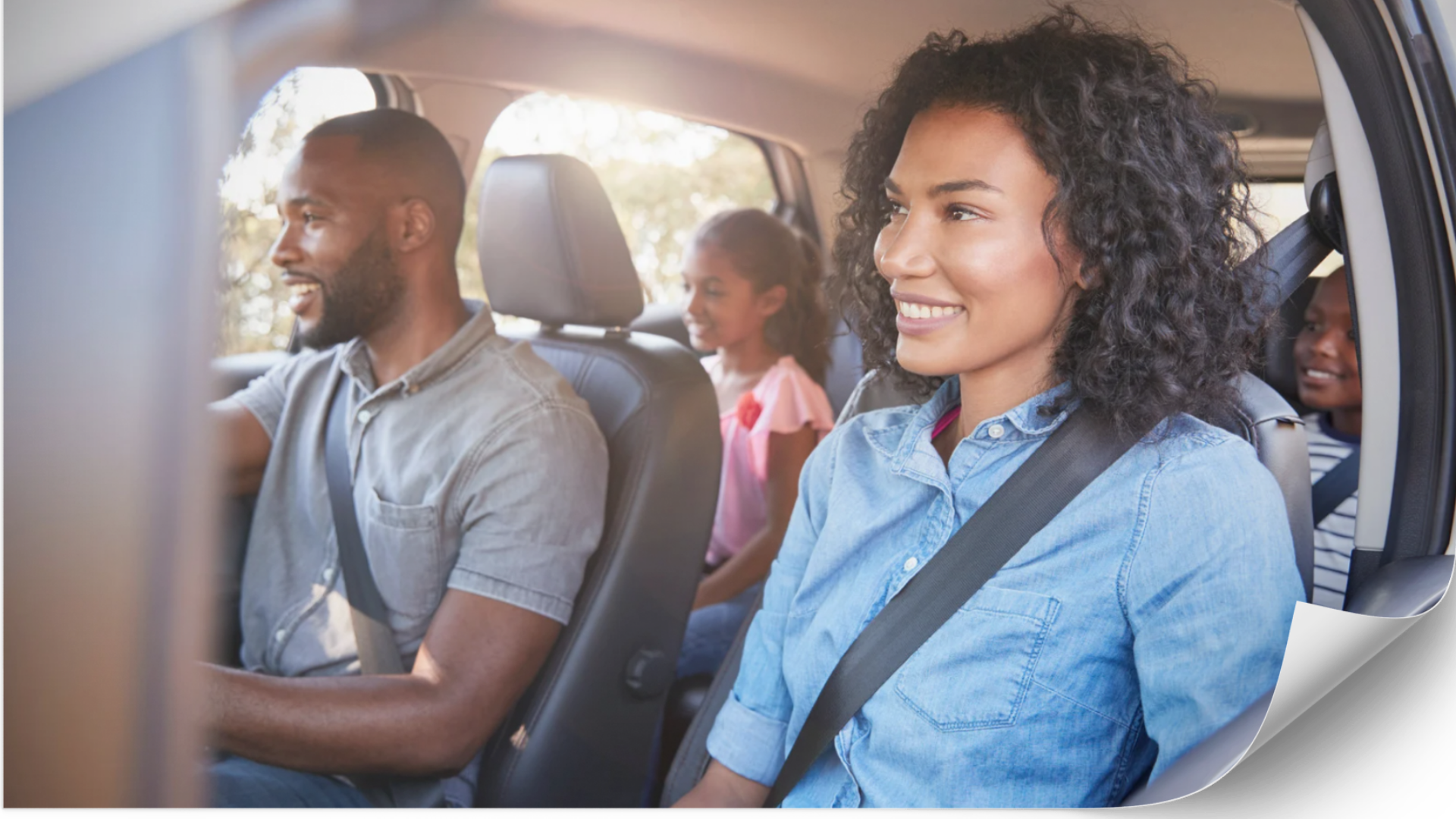 Happy couple sitting in a vehicle